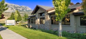 The Nexstep Medical Detox Center Modern Business Front In Neutral Colors, Against An Orem, Ut Scenic Mountain Backdrop.